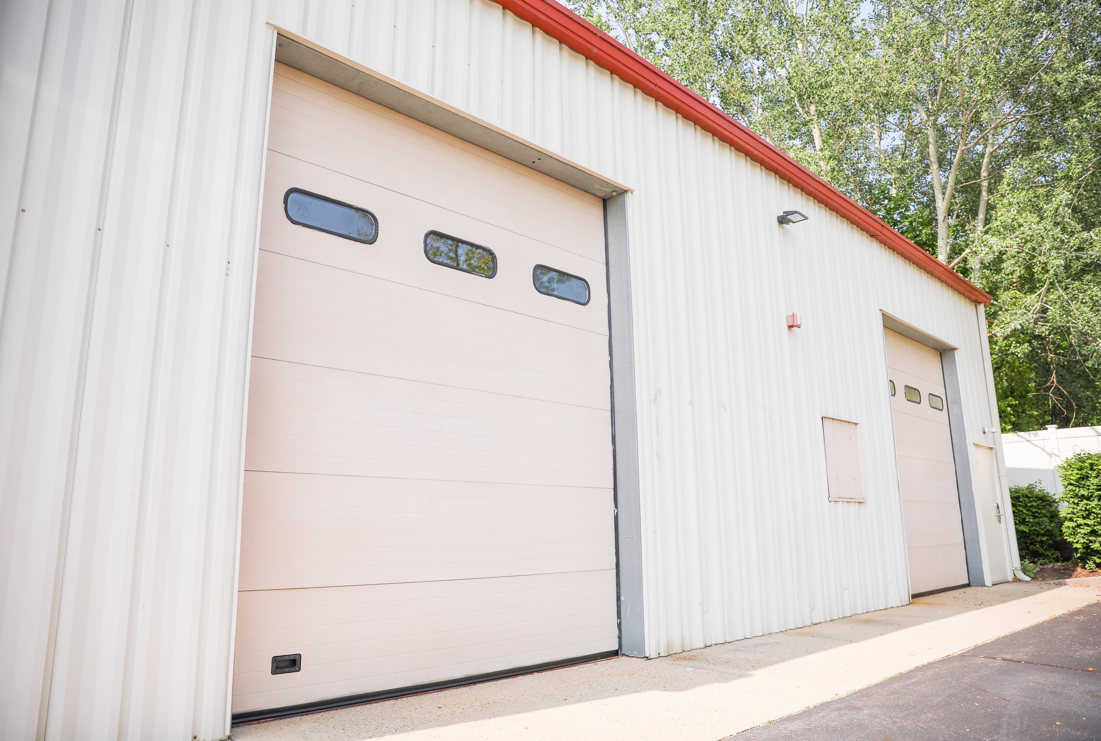 Garage Door Contractors at work, the trade Servgrow garage door software is built for