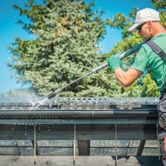 Gutter Cleaners at work, the trade Servgrow gutter cleaning software is built for